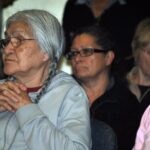 Madeline Spence (left) waits to share her residential school experience at the national TRC event in Winnipeg. Photo: Marites N. Sison