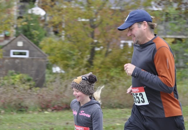 A father and daughter cross the finish line together at fundraiser for Council of the North. Photo: Courtesy of the Parish of Lloydtown