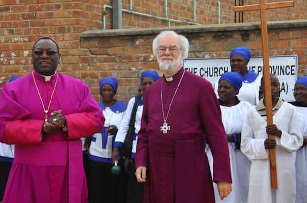 Then Archbishop of Canterbury Rowan Williams (right) visited the embattled diocese of Manicaland to show his support during his trip to Zimbabwe in 2011. With him in the photo are members of the diocese and Bishop Julius Makoni. Photo: ACNS