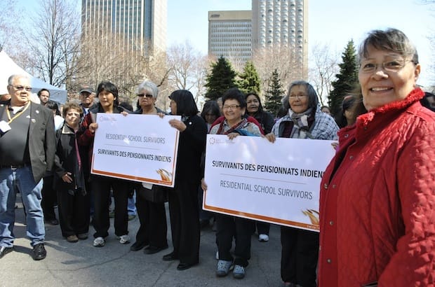 Hundreds of former Indian residential school studentsjoin a "Survivor's Walk and Procession" at the opening day of the TRCQuebec National Event in Montreal. Photo: Marites N. Sison