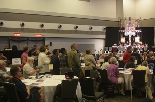 General Synod members line up on July 6 to speak to the resolution proposing a change to the church's marriage canon, to allow the marriage of same-sex couples. Photo: Art Babych