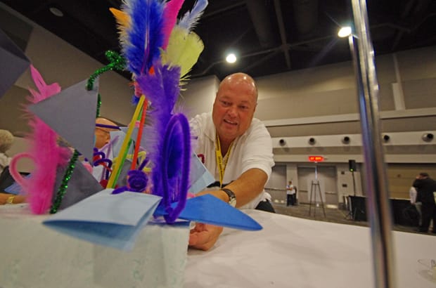 Alex McKay from the ELCIC Alberta and the Territories Synod puts the finishing touches on his table's art. Photo: Simon Chambers