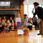 Ralph Singh, author of Stories to Light Our Way, reads to school children and their parents. Photo: Courtesy of Ralph Singh