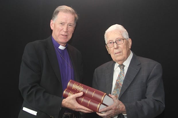 Archbishop Fred Hiltz is presented with a copy of a new two-volume work by the author, Jack Francis, the diocese of Ottawa's Archivist Emeritus. Photo: Art Babych