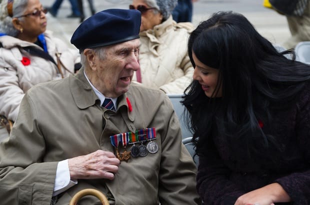 A young journalist speaks with a veteran after Remembrance Day services last year at the Old City Hall cenotaph in Ottawa. Photo: Canadapanda/Shutterstock
