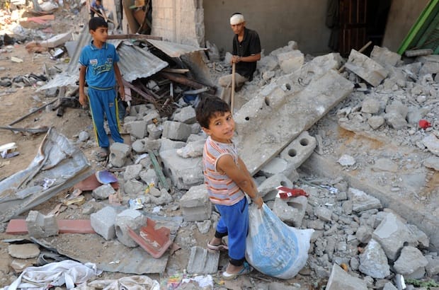 Palestinians sift through the rubble of their destroyed home. Photo: UN Photo/Shareef Sarhan
