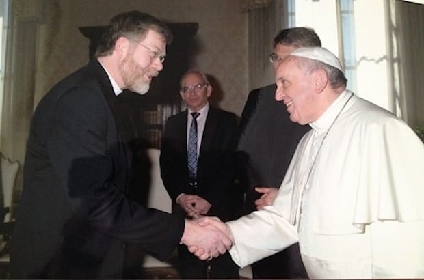 Canon John Gibaut (left), pictured here with Pope Francis, is well-known in ecumenical circles. Photo: Courtesy of John Gibaut/ACNS