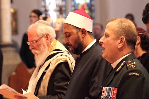 (L to R) Rabbi Barry Schlesinger of the Agudath Israel Congregation, Imam Samy Metwally from the Ottawa Main Mosque and Padre John Fletcher, Chaplain General to the Canadian Forces take part in the interfaith service in Ottawa. Photo: Art Babych