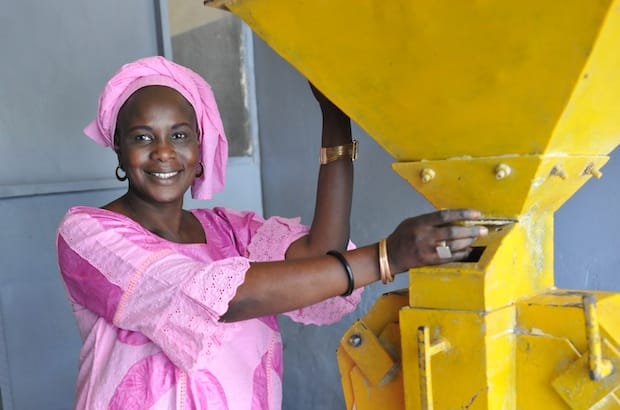 Using a solar drier and a peeling-and-grinding machine, Aby Ndao processes grains into maize, millet products, bissap powder, coffee blends and flour mixtures in Kaolack, Senegal. She used two loans from the Union des Institutions Mutualistes Communautaires d’Epargne et de Crédit (U-IMCEC) in 2011 to expand her business, which now has five employees. Photo: Jan Groenewold