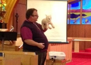 Bishop Larry Robertson of the diocese of the Yukon preps for his puppet session at Messy Church in Christ Church Cathedral, Whitehorse. Photo: Contributed