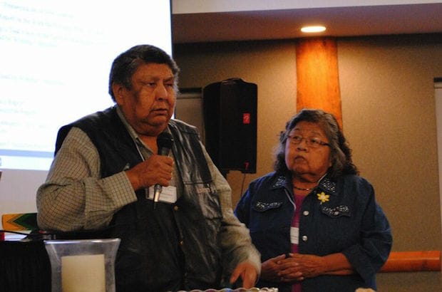 Pastoral elder Jimmy Toodlican of Scw’exmx and pastoral elder Amy Charlie of Lytton Parish move the motion to adopt the resolution. Photo: André Forget