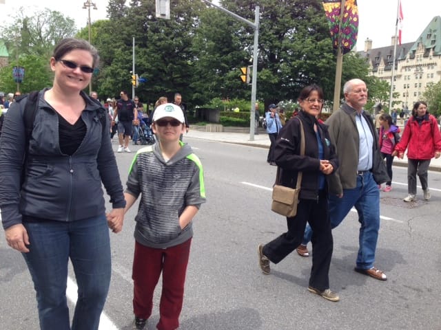   Karri Munn-Venn, Citizens for Public Justice and All Saints' Westboro, diocese of Ottawa; with son, Oscar