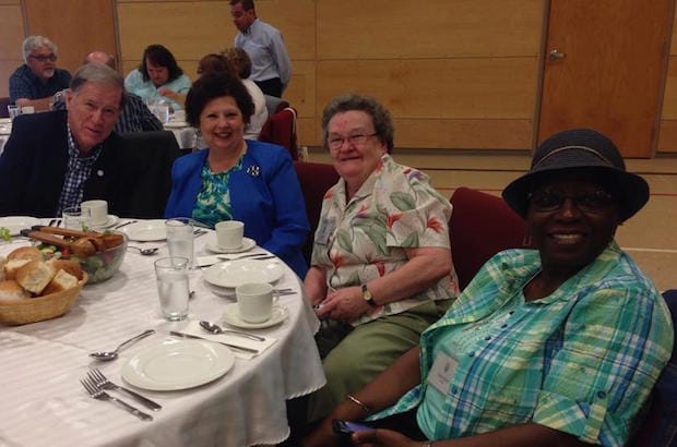 Archbishop Fred Hiltz, the Rev. Joanne Mercer (diocese of Central Newfoundland), Penny Noel (diocese of Montreal) and Valerie Bennett (diocese of Montreal) at a banquet prepared by St. John the Evangelist parishioners for Provincial Synod.