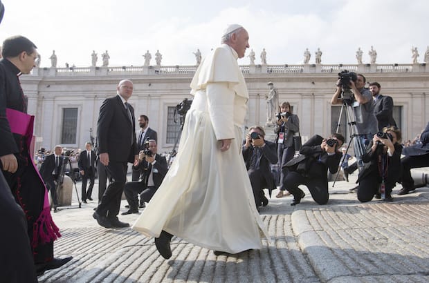 Pope Francis on his way to greet pilgrims during his weekly general audience in St. Peter's Square, at the Vatican.  Photo: Giulio Napolitano/Shutterstock 