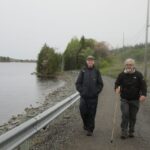 The Rev. Chris McMullen (L) and Bishop David Edwards hike along the Bay of Fundy coast during the 2015 pilgrimage. Photo: Contributed