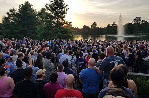 Mourners gather in Houston, Texas, to remember the victims of the Orlando Pulse shooting. Photo: Ashton Woods/Wikimedia Commons