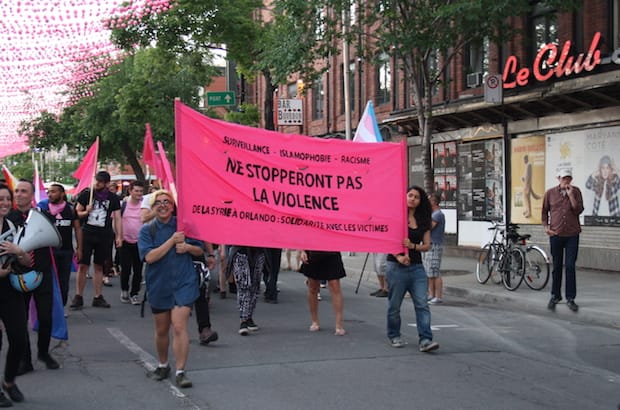 Participants march in the heart of Montreal's Gay Village June 16 for a vigil commemorating victims of the Orlando shooting. Photo: Harvey Shepherd