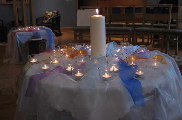 Staff lit 49 candles for victims of the Orlando shootings at a requiem service held at the Anglican Church of Canada's national office June 23. Photo: André Forget