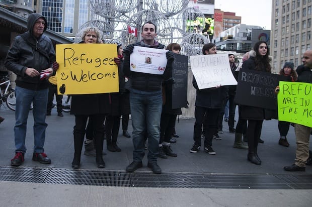 Members of interfaith groups stage a solidarity rally to welcome Syrian refugees to Canada last November in Toronto. Photo: Arindambanerjee/Shutterstock