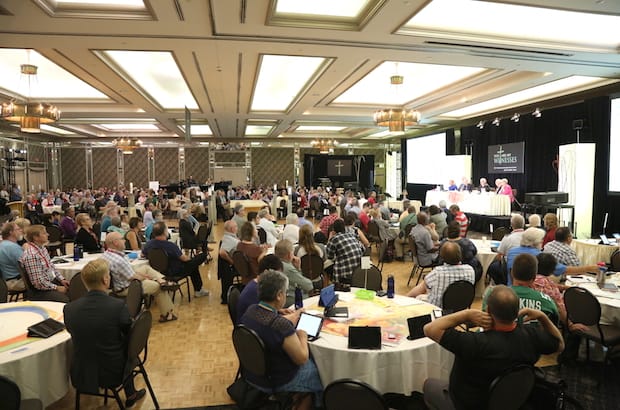 By a vote of 159-54, General Synod members vote to suspend, for the duration of their meeting, a rule requiring a vote for or against a motion unless they have a material conflict of interest. Photo: Art Babych