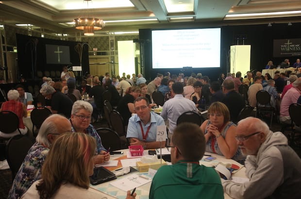 General Synod members discuss three questions at their tables, including what marriage means to them. Photo: Art Babych