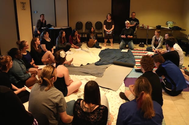 Youth delegates take part in a blanket exercise during a pre-General Synod orientation and ice-breaker. Photo: Art Babych