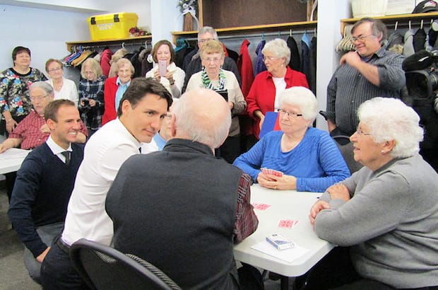 Prime Minister Justin Trudeau chats with members of St. Margaret’s coffee club in Fredericton Jan.17, as part of his nationwide town hall tour. Photo: Gisele McKnight