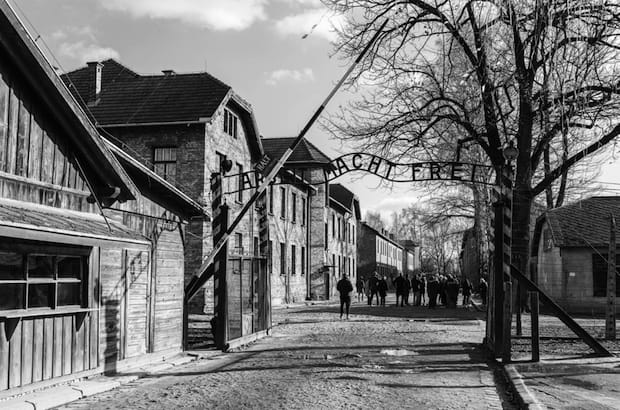 Main gate of Auschwitz-Birkenau, one of three main concentration camps established by the Nazi regime in Oswiecim, Poland, in the 1940s. It was converted into a Holocaust memorial and museum in 1947. Photo: Olga Koverninska