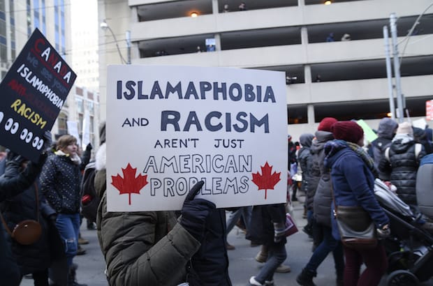Protesters denounce the Trump administration's refugee and immigration policies in front of the U.S. Consulate in Toronto February 4. Photo: arindambanerjee/Shutterstock