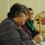Indigenous Ministries co-ordinator Canon Ginny Doctor performs on a traditional drum to introduce a suicide prevention talk by Anglican priest and psychologist Canon Martin Brokenleg in Toronto March 27. Photo: Tali Folkins