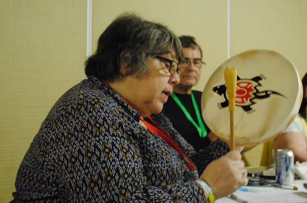 Indigenous Ministries co-ordinator Canon Ginny Doctor performs on a traditional drum to introduce a suicide prevention talk by Anglican priest and psychologist Canon Martin Brokenleg in Toronto March 27. Photo: Tali Folkins