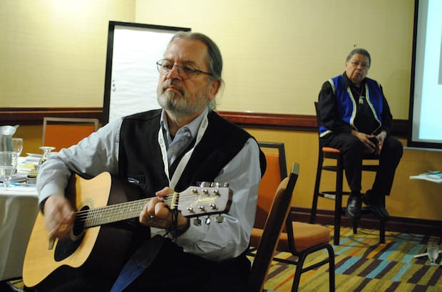 National Indigenous Anglican Bishop Mark MacDonald, left, sings a hymn to introduce a talk on suicide prevention by psychologist Canon Martin Brokenleg, right, at a Toronto workshop Monday, March 27. Photo: Tali Folkins