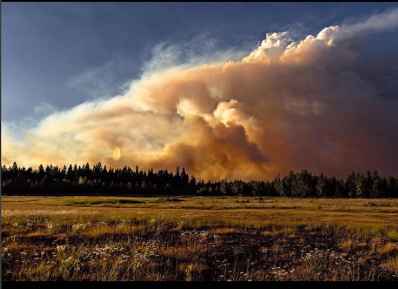 Smoke billows near 100 Mile House, where all 2,000 residents have been evacuated. Instagram Photo: @clinttrahan