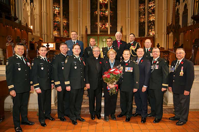 Nancy Mallett is honoured at the 2014 exhibit on the military chaplaincy. Photo: Michael Hudson