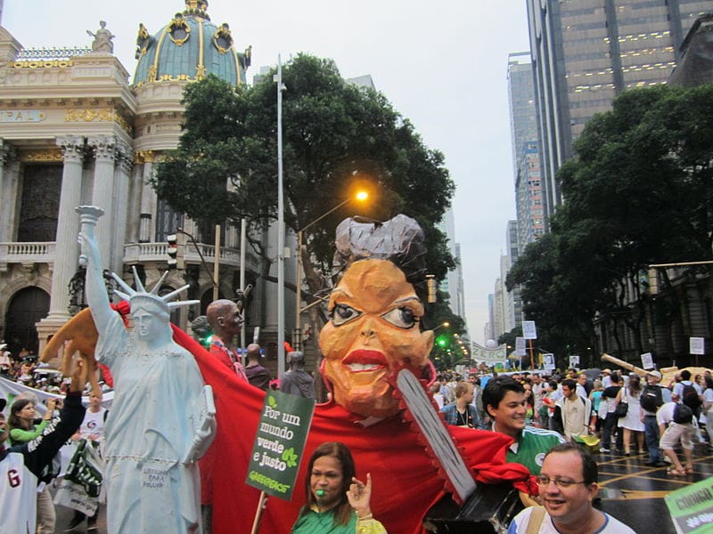 Demonstrators carry an image of Brazilian president Dilma Rousseff through the streets of Rio de Janeiro during the Rio+20 summit. Photo: Aliencow/Wikimedia Commons.