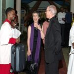 Archbishop Justin Welby and his wife Caroline (centre),accompanied by Archbishop Dr John Holder (right), primate of theProvince of the West Indies and bishop of Barbados, share a laugh withpeople they met during their visit to the Church of the Province of the West Indies in 2013. Photo: archbishopofcanterbury.org
