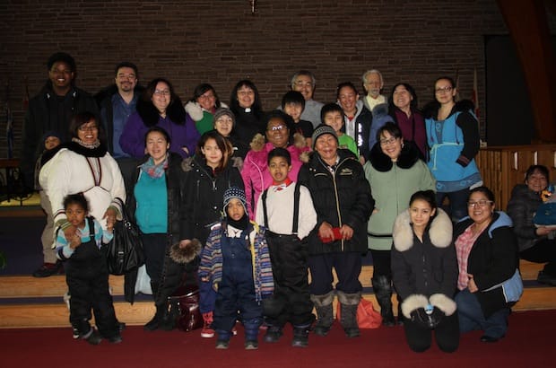 Members of Annie Ittoshat’s first Montreal congregation gather for a group photo. Ittoshat is fifth from the left in a clerical collar; her husband, Noah, is next to her. Photo: Harvey Shepherd