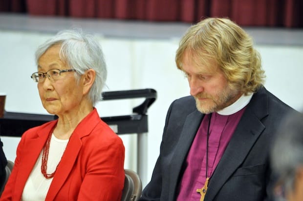 Mary Kitigawa (left) accepted the apology document from Bishop Greg Kerr-Wilson (right) and Bishop Melissa Skelton. Photo: Randy Murray
