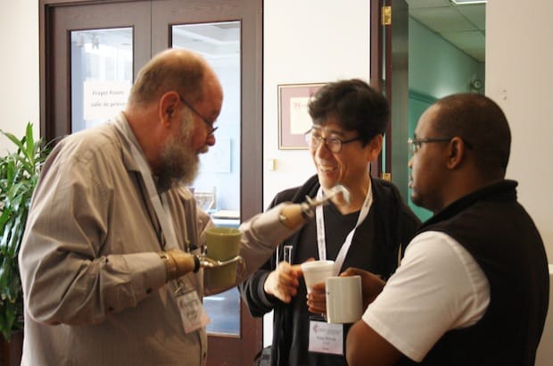 Michael Lapsley chats with Nak-Hyon Joo of Korea and Lapsley's personal assistant, Mosuoe Rakuoane. Photo: Harvey Shepherd
