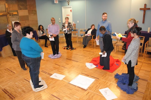 Staff at the office of General Synod take part in the Blanket Exercise, a teaching tool in Indigenous Canadian history, at the Chapel of the Holy Apostles February 17. Photo: Tali Folkins