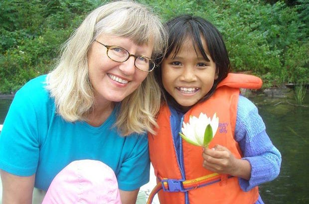 Debra Fieguth in 2008 with Eh Ka Moo, a five-year-old refugee she had helped bring to Canada from Myanmar. Photo: Contributed