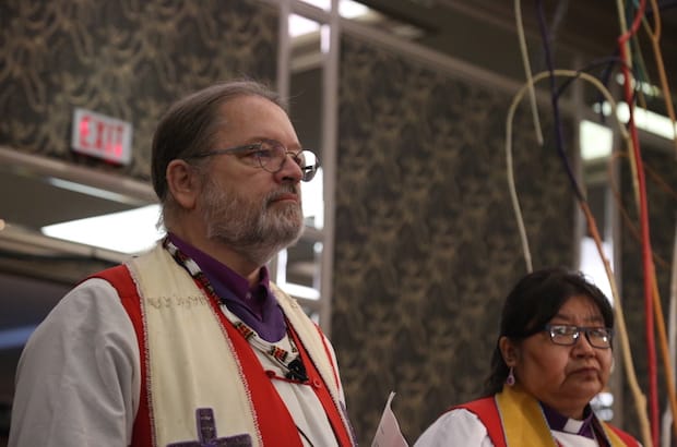 National Indigenous Anglican Bishop Mark MacDonald, left, and Bishop Lydia Mamakwa, of the Indigenous Spiritual Ministry of Mishamikoweesh, during the opening worship at General Synod 2016. Photo: Art Babych