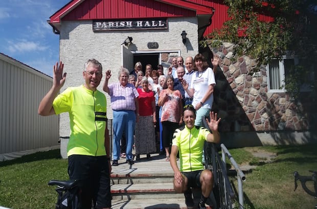 Bishop Rob Hardwick (left) and his son, Robert (right), with members of St. Mary's parish in Whitewood, Sask., one of 18 churches he visited during his "pedalling pilgrimage of prayer." Photo: Lorraine Hardwick
