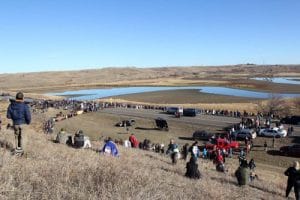 The interfaith witness formed a huge Niobrara Circle of Life just south of the backwater bridge where on the other side law enforcement officers kept watch. Opponents of the Dakota Access Pipeline have held the bridge since law enforcement on Oct. 24 cleared a newly set up protest camp. Photo: Lynette Wilson/Episcopal News Service