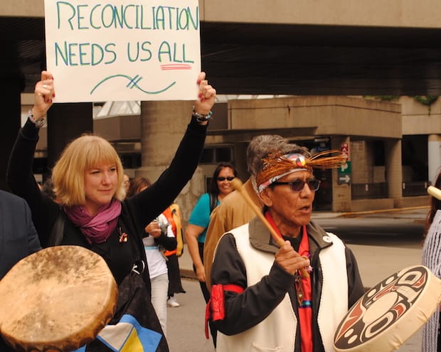 New reconciliation animator Melanie Delva (left) and Indian residential school survivor Terry Aleck at the TRC’s Walk for Reconciliation in 2015. File photo: Anglican Journal