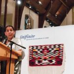 Debra Sparrow of the Musqueaum First Nation in Vancouver speaks at the opening of the Anglican Foundation of Canadas textile exhibition. Her work, Chiefs Blanket, is behind her. Photo: Neale Adams 