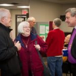 Bishop Michael Oulton, of the diocese of Ontario, shares a moment with Greg and Liz Smith of St. Luke's parish, Lyndhurst, Ont., during an “open house” at the new diocesan office Friday, May 5. Photo: Mark Hauser
