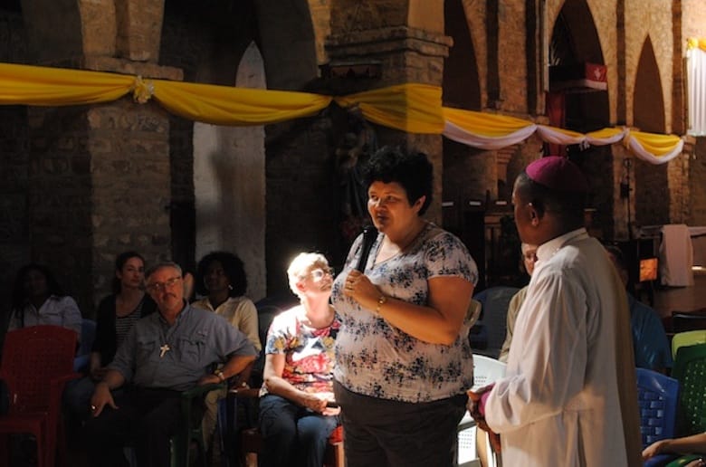 Elin Goulden, social justice and advocacy consultant for the diocese of Toronto, introduces herself St. Mary and St. Bartholomew Cathedral in Masasi,  while Bishop James Almasi translates. Photo: André Forget