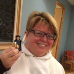 The Rev. Dawn Leger, an Anglican priest who serves as pastor at First Evangelical Lutheran Church, Toronto, enjoys taking her “Little Luther” along on her travels. Photo: Marites N. Sison