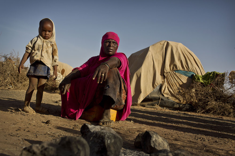 Roda Mohamud and her niece Ayan outside their makeshift home near the town of Burao, Somalia. They had been forced to leave their village after a prolonged drought. Photo: © UNICEF/UN057360/Holt